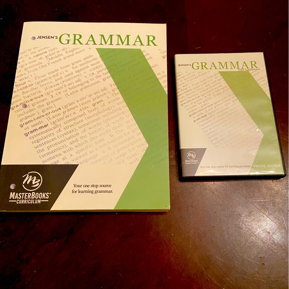 Masterbooks Curriculum Jensen’s Grammar book with DVD. Never used.